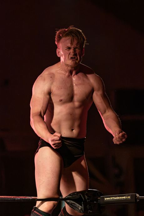 Character photo of a warrior holding a spear in dramatic low light