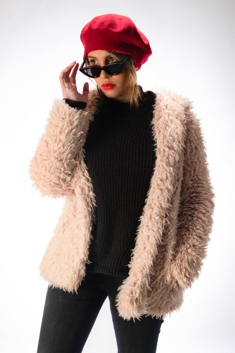 Portrait of a woman in a red beret, sunglasses and pink faux-fur jacket